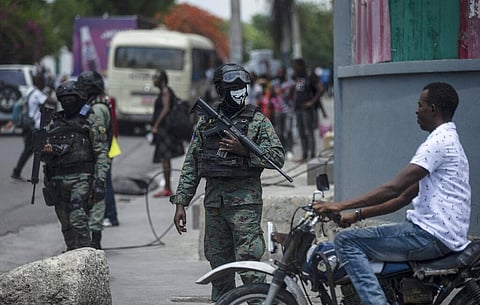 Armed forces secure the area of state offices of Port-au-Prince, Haiti on Monday.