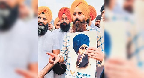 Hardliners protest with extremist Jarnail Singh's pictures in Chandigarh.