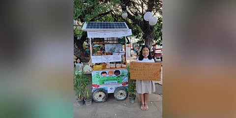 Licypriya Kangujam at her ‘plastic money shop’ set up in DU | express