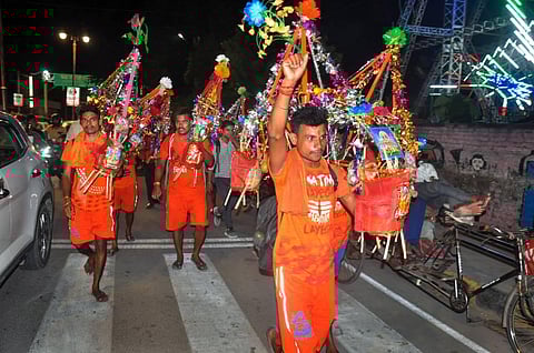 Kanwariyas raise slogans on the first day of holy month of 'Sawan' during the 'Kanwar Yatra', in Moradabad, Thursday, July 14, 2022. (Photo | PTI)