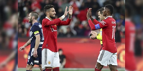 Manchester United's Alex Telles, left, congratulates teammate Rashford after scoring his team's third goal during the match against Melbourne Victory.(Photo | AP)