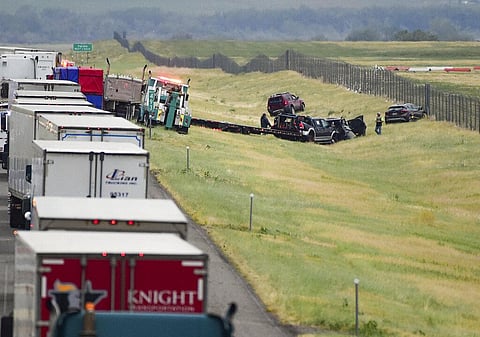 First responders work the scene on Interstate 90 after a fatal pileup where at least 20 vehicles crashed near Hardin, Montana, on July 15, 2022. (Photo | AP)