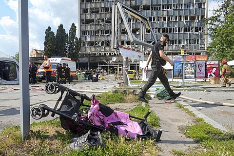A baby stroller lies by a road after a deadly Russian missile attack in Vinnytsia, Ukraine. (Photo | AP)