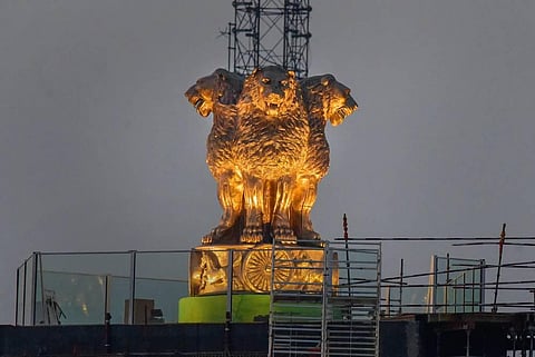 Newly unveiled National Emblem cast made of bronze on the roof of new Parliament House building, in New Delhi, Tuesday, July 12, 2022. (Photo | PTI)