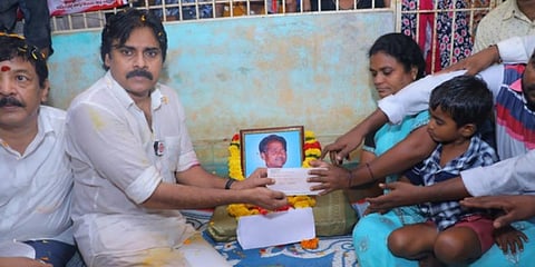 Pawan Kalyan hands over aid to kin of a tenant farmer in Mandapeta. (Photo I Express)