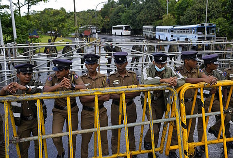 Policemen stand guard outside the parliament building in Colombo, Sri Lanka, Saturday, July 16, 2022. (Photo | AP)