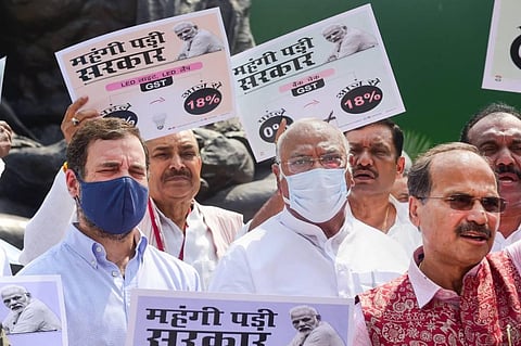 Congress MP Rahul Gandhi with party and other opposition MPs during a protest against inflation and increase in GST on food items, near the Gandhi statue at Parliament. (Photo | PTI)