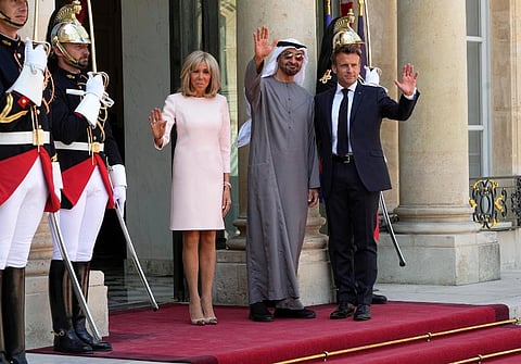 France's President Emmanuel Macron, right, and his wife Brigitte Macron, left, welcome United Arab Emirates' President Sheikh Mohammed Bin Zayed at the Elysee Palace in Paris. (Photo | AP)