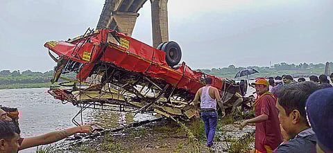 A Maharashtra State Road Transport Corporation bus being lifted out after it fell into the Narmada river, in Dhar district, on July 18, 2022. (Photo | PTI)