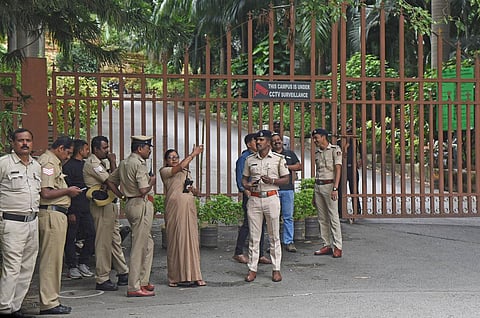 Police personnel stationed outside National Hill View Public School at RR Nagar in Bengaluru on Monday. (Photo | Vinod Kumar T)