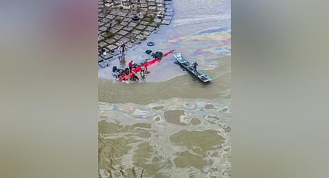 A Maharashtra State Road Transport Corporation bus being lifted out after it fell into the Narmada river, in Dhar district, on July 18, 2022. (Photo | PTI)
