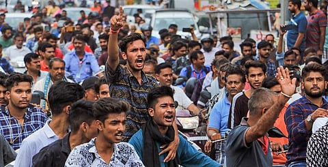 People raise slogans during the funeral procession of tailor Kanhaiya Lal in Udaipur. (Photo | PTI)