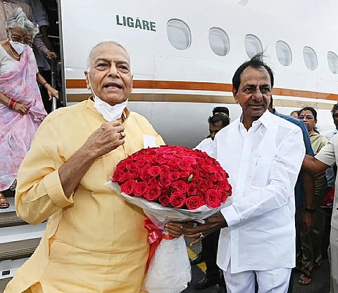 Telangana Chief Minister K Chandrashekhar Rao receives Presidential candidate Yashwant Sinha at Begumpet Airport, in Hyderabad. (Photo | PTI)