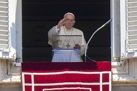 Pope Francis delivers his blessing as he recites the Angelus noon prayer from the window . (Photo | AP)