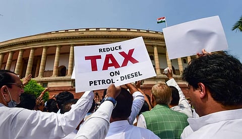 Opposition MPs stage a protest against inflation and the Union government's decision to increase GST on food items, at Parliament complex, in New Delhi. (Photo | PTI)