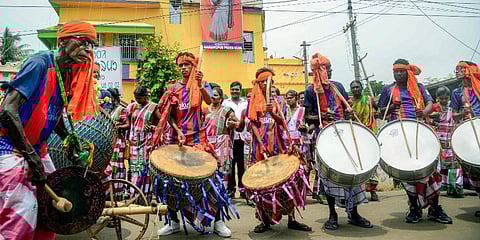 Tribal artists perform in anticipation of the results of Presidential Elections 2022 favouring Draupadi Murmu, near her residence in Rairangpur. (Photo | PTI)