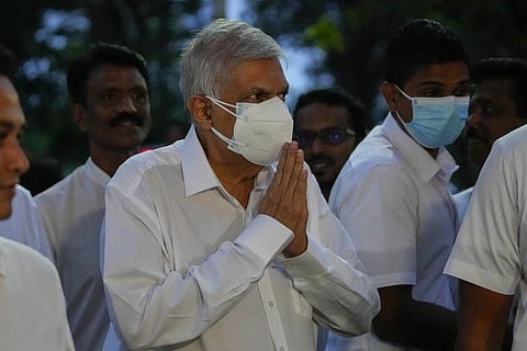 President elect Ranil Wickremesinghe greats supporters upon his arrival at a buddhist temple in Colombo, Sri Lanka, Wednesday, July 20, 2022. (Photo | AP)