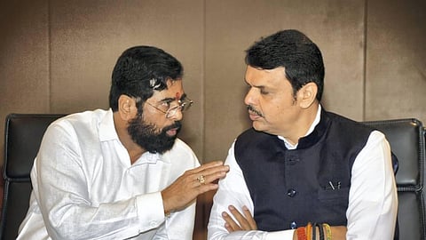 Eknath Shinde talks to CM Devendra Fadnavis.