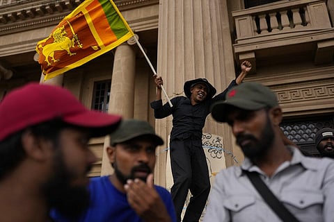 A protester shouts slogans demanding elected president Ranil Wickremesinghe step down during a protest at the presidential secretariat premise in Colombo. (Photo | AP)