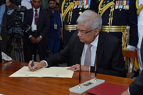Sri Lankan President's Office, Sri Lanka's newly elected president Ranil Wickremesinghe, signs after taking oath during his swearing in ceremony in Colombo. (Photo | Special Arrangement)
