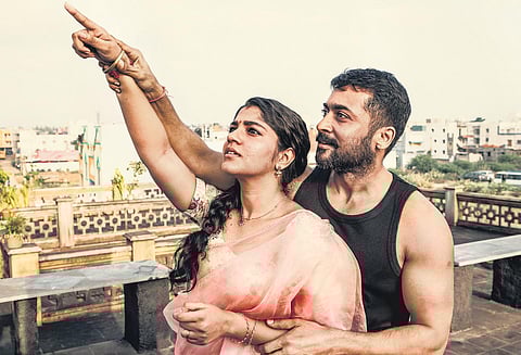 Aparna Balamurali and Suriya in a still from 'Soorarai Pottru'.
