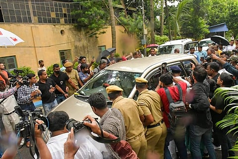 West Bengal Minister Partha Chatterjee being taken to custody by ED officials, after around 26 hours of grilling in connection with its investigation into the SSC scam. (Photo | PTI)