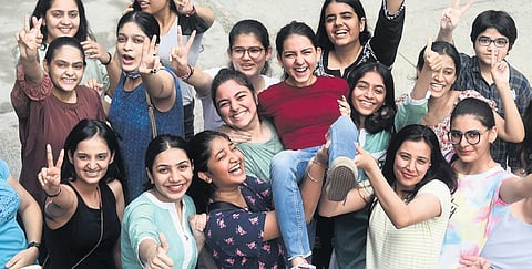 Students celebrate after the announcement of the CBSE Class XII exam results at St. Thomas Girls Senior Secondary School, in New Delhi on Friday | Parveen Negi