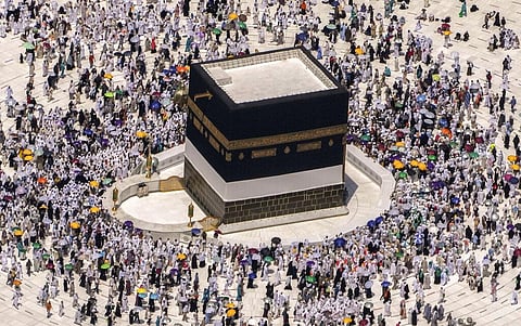 Muslim pilgrims walk around the Kaaba, the cubic building at the Grand Mosque, during the annual hajj pilgrimage, in Mecca, Saudi Arabia. (Photo | AP)