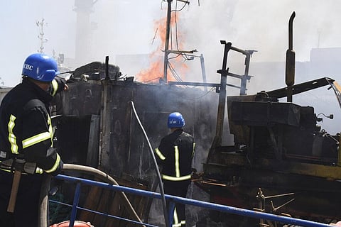 Firefighters put out a fire in a port. (Photo | AP)