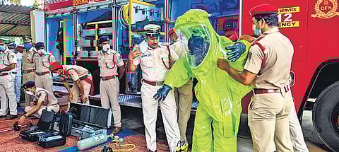 A firefighter wearing a chemical suit that comes with an Advance Rescue Tender vehicle to help firemen during rescue services, at Odisha Fire and Disaster Response Academy in Bhubaneswar. (Photo| EPS)