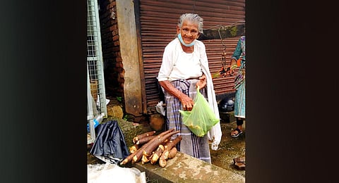 Sulaiha Beevi places tapioca for sale. (Photo | Express)