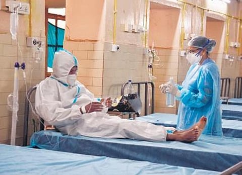 A nurse attends to a suspected Monkeypox patient at Fever Hospital in Hyderabad on Monday