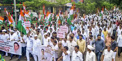 Former Maharashtra Chief Minister Prithviraj Chavan with Congress workers stage a protest march against ED's questioning of party's interim president Sonia Gandhi | PTI