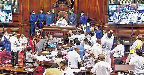 TV grab of Opposition members protesting in the Well of the Rajya Sabha during the ongoing monsoon session of Parliament, in New Delhi. (Photo | PTI)