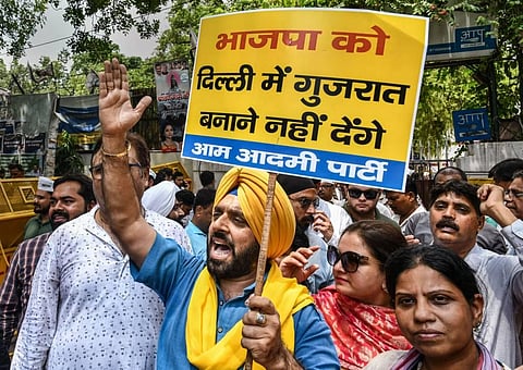 Members of Aam Aadmi Party stage a protest against the BJP over Gujarat hooch tragedy, in New Delhi, Wednesday, July 27, 2022. (Photo | PTI)