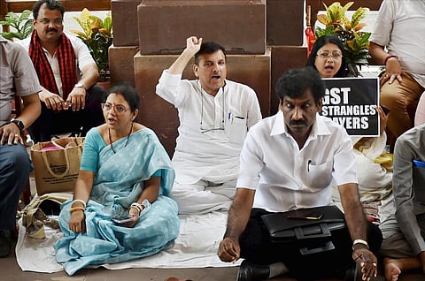 AAP MP Sanjay Singh and TMC MPs protest at Parliament House during ongoing Monsoon Session, in New Delhi, Thursday. (Photo | PTI)