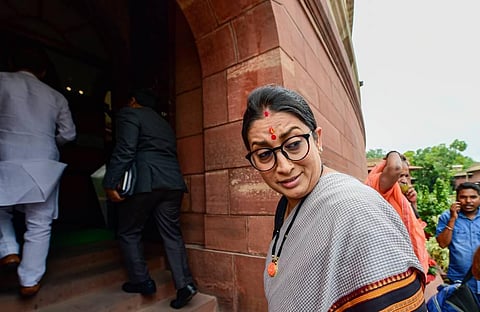Union Minister for Women and Child Development Smriti Irani arrives at Parliament House during ongoing Monsoon Session, in New Delhi. (Photo | PTI)