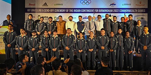 Sports Minister Anurag Thakur with Indian contingent during the kit unveiling and send-off ceremony for the Birmingham 2022 CWG, in New Delhi.(Photo | PTI)