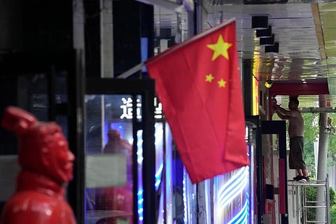 China's economy contracted in the three months ending in June compared with the previous quarter after Shanghai and other cities shut down to fight coronavirus outbreaks. (Photo | AP)