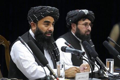 Zabiullah Mujahid, left, the spokesman for the Taliban government, speaks during a press conference in Kabul, Afghanistan. (Photo |AP)
