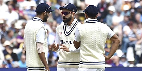 India's Virat Kohli, centre, talks to India's Jasprit Bumrah, left, and India's Shardul Thakur during the third day of the fifth cricket test match against England.(Photo | AP)