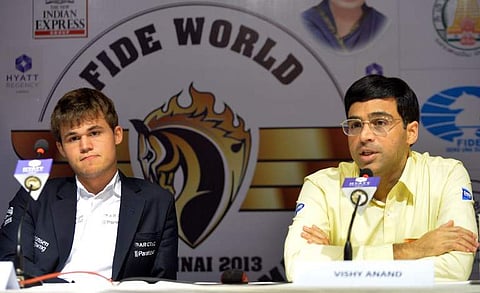 In this file photo, Norwegian Magnus Carlsen (L) listens during a joint press conference with India's Viswanathan Anand (R). (Pic | AFP)