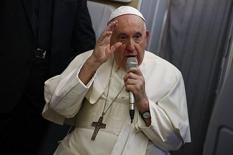 Pope Francis speaks to journalists aboard the papal flight back from Canada on Saturday, July 30, 2022. (Photo | AP)