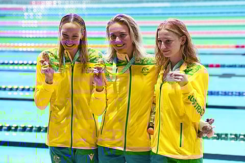 Bronze medalist Madison Wilson, gold medalist Ariarne Titmus and silver medalist Mollie O'Callaghan. (Photo | AP)