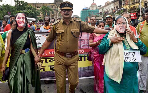 BJP supporters during a protest rally against TMC leader Partha Chatterjee and SSC scam case, in Kolkata, Thursday, July 28, 2022. (Photo | PTI)