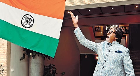 Megastar Amitabh Bachchan shared on Twitter an image of him waving tricolour at his house early this month. (Photo | Twitter)