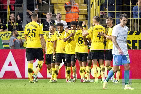 Borussia Dortmund players celebrate after scoring, during the German Soccer Cup 1st round match betwen 1860 Munich and Borussia Dortmund, in Munich. (Photo | AP)