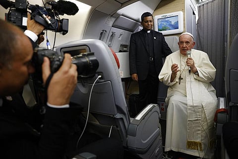 Pope Francis speaks to journalists aboard the papal flight back from Canada on Saturday, July 30, 2022, where he paid a six-day pastoral visit. (Photo | AP)