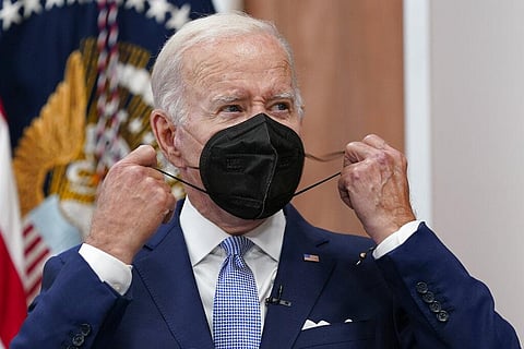 President Joe Biden removes his face mask as he arrives to speak about the economy during a meeting with CEOs in the South Court Auditorium on the White House complex in Washington, July 28(Photo| AP)