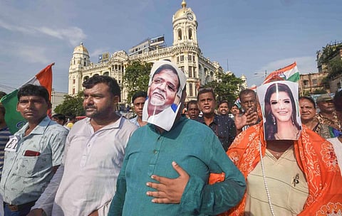 Congress activists take part in a protest rally against West Bengal Minister Partha Chatterjee and SSC scam case, in Kolkata, Saturday, July 30, 2022. (Photo | PTI)